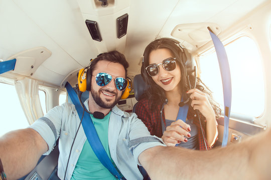 Young Couple In Airplane