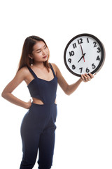 Young Asian woman with a clock.