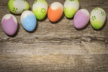 Fototapeta na wymiar Easter eggs on rustic wood