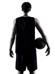 Fototapeta premium one caucasian basketball player man isolated in silhouette shadow on white background