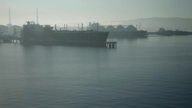 Departure of LNG tanker from terminal in haze