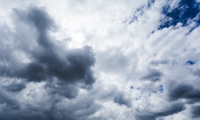 Background of dark clouds. A dramatic autumn sky with gray dense clouds before downpour.