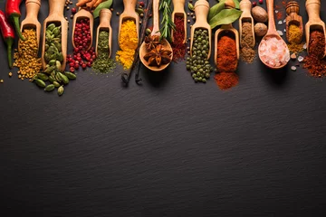  Various spices on black slate. Top view with free space © andriigorulko