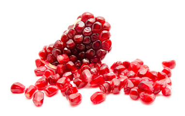 Ripe pomegranate fruit seeds isolated on a white