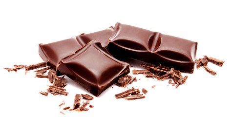 Dark chocolate bars stack with crumbs isolated on a white