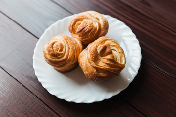Fresh bread rolls on a white plate