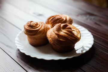 Fresh bread rolls on a white plate
