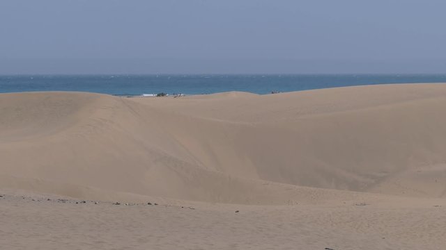 Dunes, Ocean and Tourists at Playa del Ingles