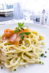 tasty pasta with salmon on a the table