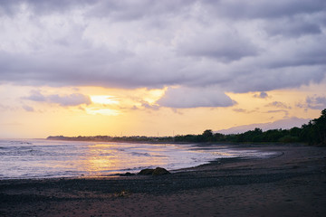 Naklejka na ściany i meble Beautiful landscape. Sunset on the sea shore.