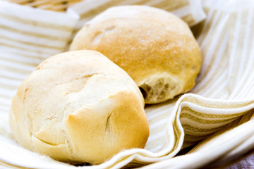 bread in basket - little roll breads in basket on table