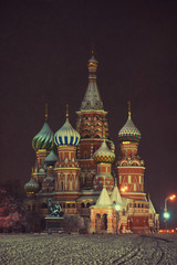 Obraz premium View of Moscow Kremlin and St Basil's Church in winter at night, Russia.