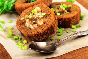 Bread with meat and onions on a wooden table