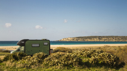 Bus ocean sand mountains