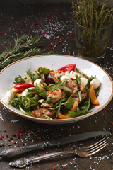 Vegetarian salad from vegetables, arugula and mozzarella