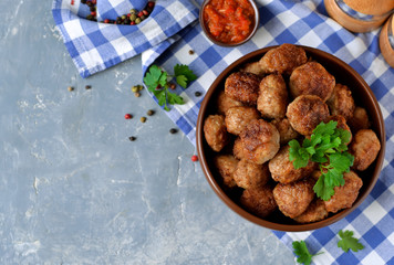 Home meatballs with spices on a concrete background