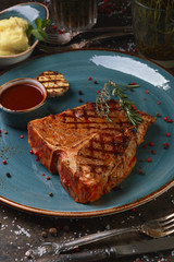 Steak T-bone with mashed potatoes and sauce