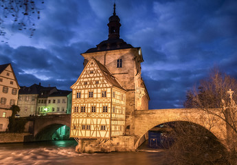 Fototapeta na wymiar Famous Bamberg town hall with Regnitz river at night, Bavaria, Germany