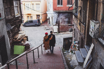 Fototapeta na wymiar Couple walking at old istanbul streets in Balat