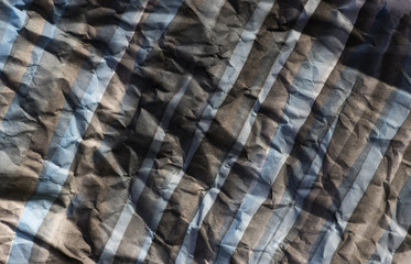 Background of colored crumpled paper shot close-up 