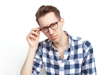 Thoughtful man touching glasses