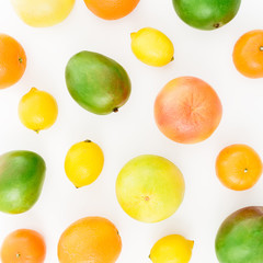 Lemon, orange, grapefruit, sweetie and sweet mangos on white background. Flat lay, top view. Food background