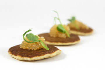 Mini pancake with caviar of pike