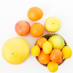 Citrus on white background. Flat lay, top view. Fruits in summer
