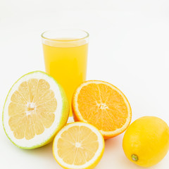 Fresh juice of lemon, orange and sweetie on white background. Flat lay, top view.