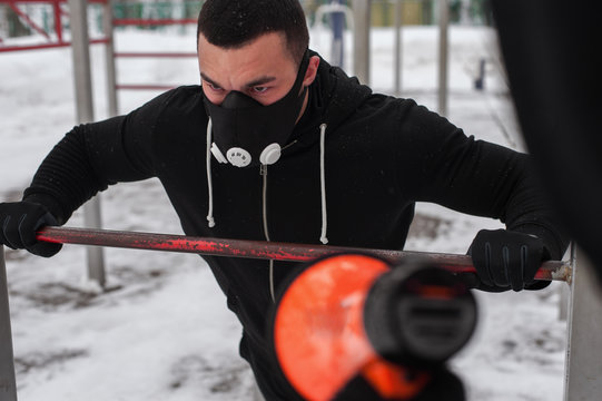 Fitness coach motivating young man via loudspeaker