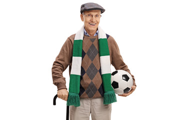 Elderly soccer fan with a scarf and a football