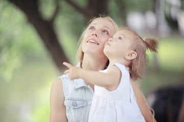 Fototapeta premium Mother hugging little daughter portrait