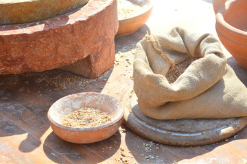 The ground flour with a stone and gathered in canvas bags in medieval style