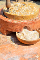 The ground flour with a stone and gathered in canvas bags in medieval style