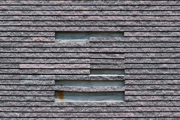 Closeup peeled of the striped stone like tile wall texture