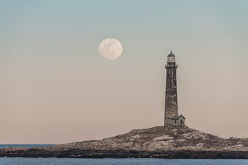pink moon rising over thacher island