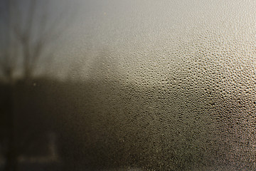 light through the drops on the glass, condensate and fogging