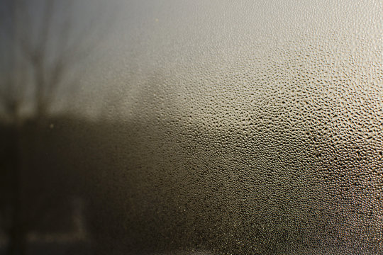 light through the drops on the glass, condensate and fogging