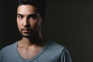 Fototapeta premium Portrait of a normal boy over grey background . Attractive young man