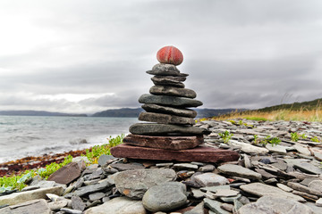 mystical cairn on the shores of the Arctic Ocean