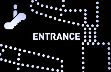 escalator LED sign on a board and ENTRANCE text