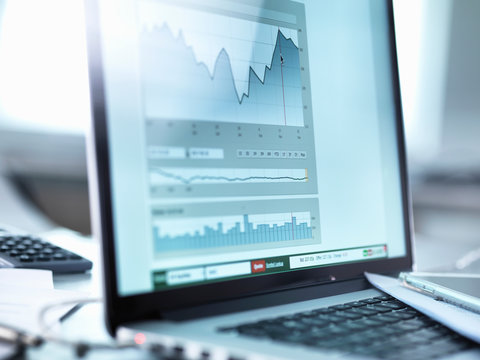 Share price data from investor's portfolio on a laptop computer screen