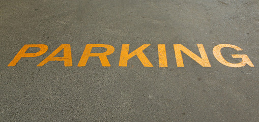 parking sign painted on street