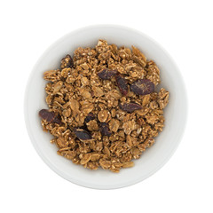 Top view of organic cranberry nut granola in a small white bowl.