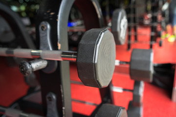 Obraz na płótnie Canvas Rod and weights in the gym