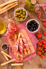 Grissini breadsticks with ham. 