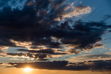 Fototapeta na wymiar Sunset sky with stormy clouds