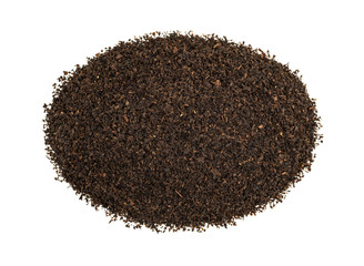 Top view of black loose leaf tea in a small pile isolated on a white background.