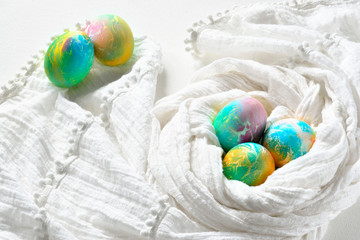 Painted colorful rainbow easter eggs on white background