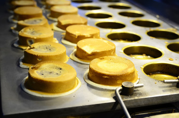 Taiwanese famous dessert/ cream cake in night market. Selective focus.